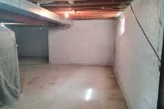Residential basement foundation walls sealed with continuous closed-cell spray foam insulation applied by Classic Spray Foam.